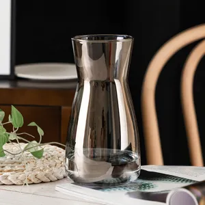 Modern Nordic style smoked grey glass vase for tabletop fresh flower arrangement and home decor.