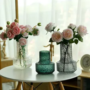 Modern minimalist glass flower vase for home decor, elegant nordic floral arrangement pot.