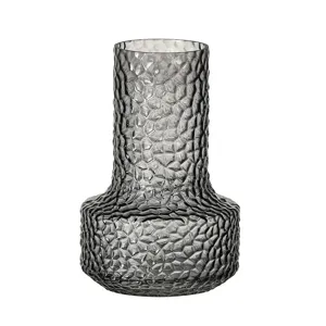 Modern smoky grey glass vase with textured faceted surface for home decor and flower arrangement.