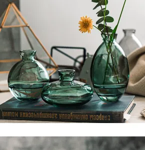 Mini green glass vase set of three, modern desktop floral arrangement decor for home living room.