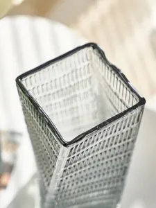 Nordic glass vase detail, transparent square flower container for living room floral decor.