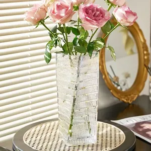 Nordic transparent glass vase with vertical ribbed design, elegant living room floral decor.