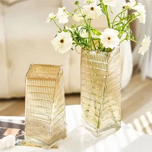 Nordic transparent glass vase set with gold vertical stripes for elegant home floral decor.
