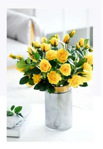 European glass vase with yellow artificial roses flower arrangement home decor centerpiece.