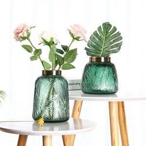 Green glass vase with copper ring, modern desktop flower arrangement for elegant home decor