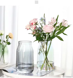 Minimalist creative luxury glass vase detail showing transparent iridescent and grey finishes.