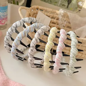 Detailed close-up of colorful plaid toothed hair hoops, showcasing soft fabric and anti-slip teeth.