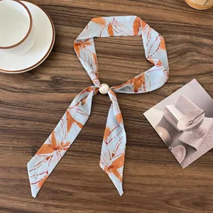 Vintage floral print ribbon scarf with pearl buckle detail, elegant thin neckerchief accessory.