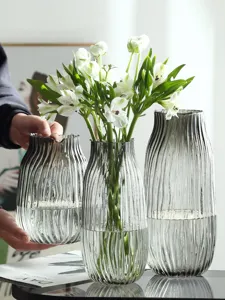 Transparent grey ribbed glass vase set for modern home decor, elegant floral table centerpiece