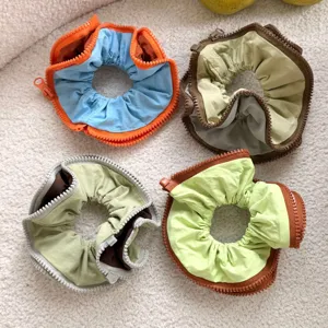 Unique zipper design scrunchie, colorful contrasting hair tie for chic hairstyles and ponytails.
