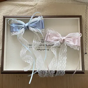Lace polka dot bow hair clip detail shot, elegant satin ribbon hairpin for sweet girls style.