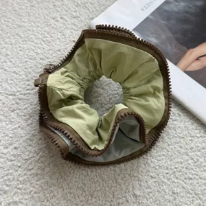 Unique zipper hair scrunchie creative green and brown design ponytail holder hair accessory.