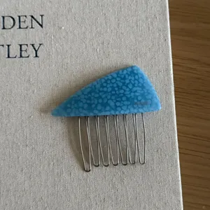 Blue acetate triangle hair comb for women, elegant side hair styling and pinning accessory.