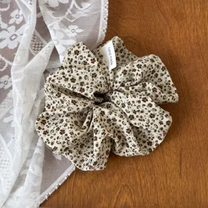 Retro floral hair scrunchie with handmade tag detail, elegant hair tie for women and girls ponytail.