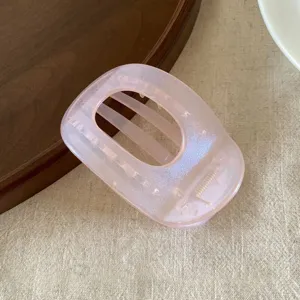 Pearl jelly pink flat oval hair claw clip, translucent shimmer shark clip detailed view.