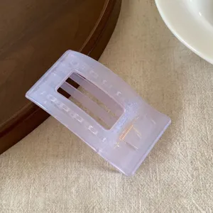 Detail view of the pearl jelly purple flat hair claw clip showing smooth resin texture.