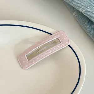 Pink polka dot fabric hair clip detail shot, sweet snap BB hair clip for cute daily hairstyles.
