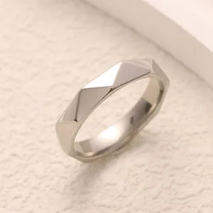 Minimalist geometric titanium steel ring with unique faceted design for couples daily wear.