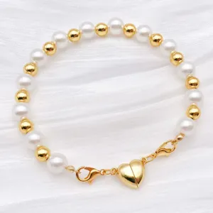 Pearl and gold bead bracelet with heart magnetic clasp, stylish daily fashion jewelry accessory.