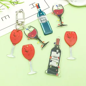 Close-up view of mixed black and red acrylic wine bottle charms for DIY jewelry making.