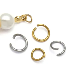 Mixed stainless steel open jump rings and pearl pendant connectors for DIY jewelry making.
