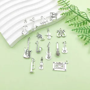 Set di ciondoli con strumenti musicali in lega argento antico per creazione gioielli DIY.