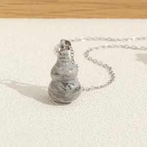 Natural stone gourd pendant necklace with silver chain, chic and unique jewelry for daily wear.