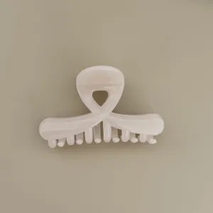 Korean glossy cross hair claw clip detail, elegant half-up style, smooth resin finish.