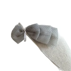 Sweet bow ponytail clip with polka dot organza and textured fabric, elegant vertical hair accessory.