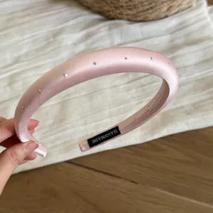 Pink satin rhinestone padded headband for women, elegant crystal hair hoop handmade accessory.