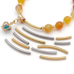 Stainless steel curved tube beads and pendant charms detail for custom DIY jewelry making.