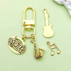 Charms d'instruments de musique en alliage or antique accessoires bijoux DIY porte-clés pendentif.