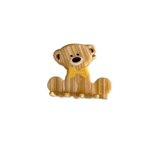 Cute acetate bear hair claw clip with yellow bow, stylish cartoon hair accessory for daily use.