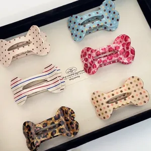 Cute polka dot bone flat hair claw clip for women, stylish vintage hair accessories detail.