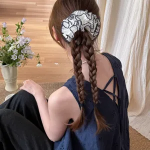 Korean sweet white lace hair scrunchie for women, elegant floral hair tie detail view.