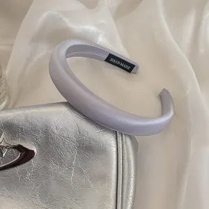 Padded satin headband for women, elegant wide hair hoop accessory for daily wear and styling.