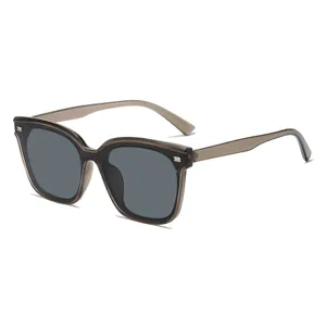 Stylish women's oversized sunglasses with transparent grey frame and dark lenses for daily sun protection.
