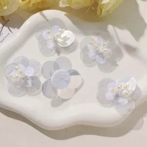 DIY handmade sequin flower patches with faux pearls, perfect for clothing and hair accessories.