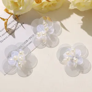 Transparent sequin flower patches with faux pearl centers for DIY handmade crafts apparel.