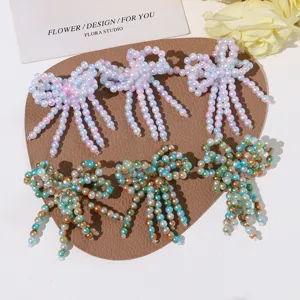 Close-up of handmade crystal beaded bow tassels, perfect for DIY crafts and decoration.