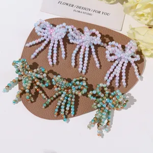 Handmade beaded crystal bow tassel patches for DIY phone case shoe flower clothing decor details.