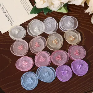 Colorful organza mesh flower patches with crystal bead centers for DIY hair accessories.