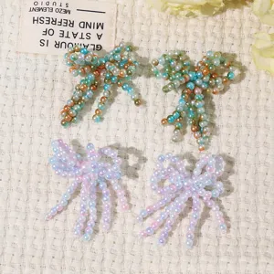 Hand-sewn beaded crystal tassel bow patch DIY handmade phone case garment clothing accessory.