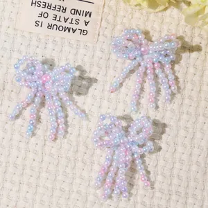 Handmade pearl beaded bow crystal fringe DIY accessories for phone case and apparel decor.