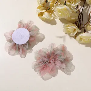 Close-up detail of gradient mesh peony hair claw clip featuring beads and backing patch.