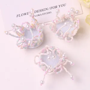 Abalorios de flores con cuentas hechos a mano, accesorios florales de borlas de perlas pasteles.