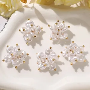 Close-up of DIY pearl and crystal flower accessories, exquisite beadwork for shoes and crafts.