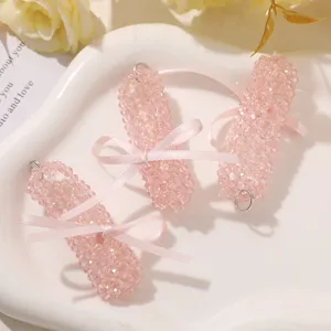 Pink crystal ribbon ballet shoe pendant detail showing beads and bow for DIY keychains.