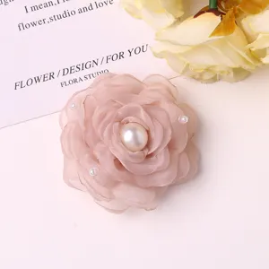 Pink organza camellia flower with artificial pearls, perfect DIY hair clip or brooch accessory.