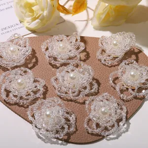 Detailed view of crystal beaded flower accessories featuring faux pearl centers for DIY crafts.